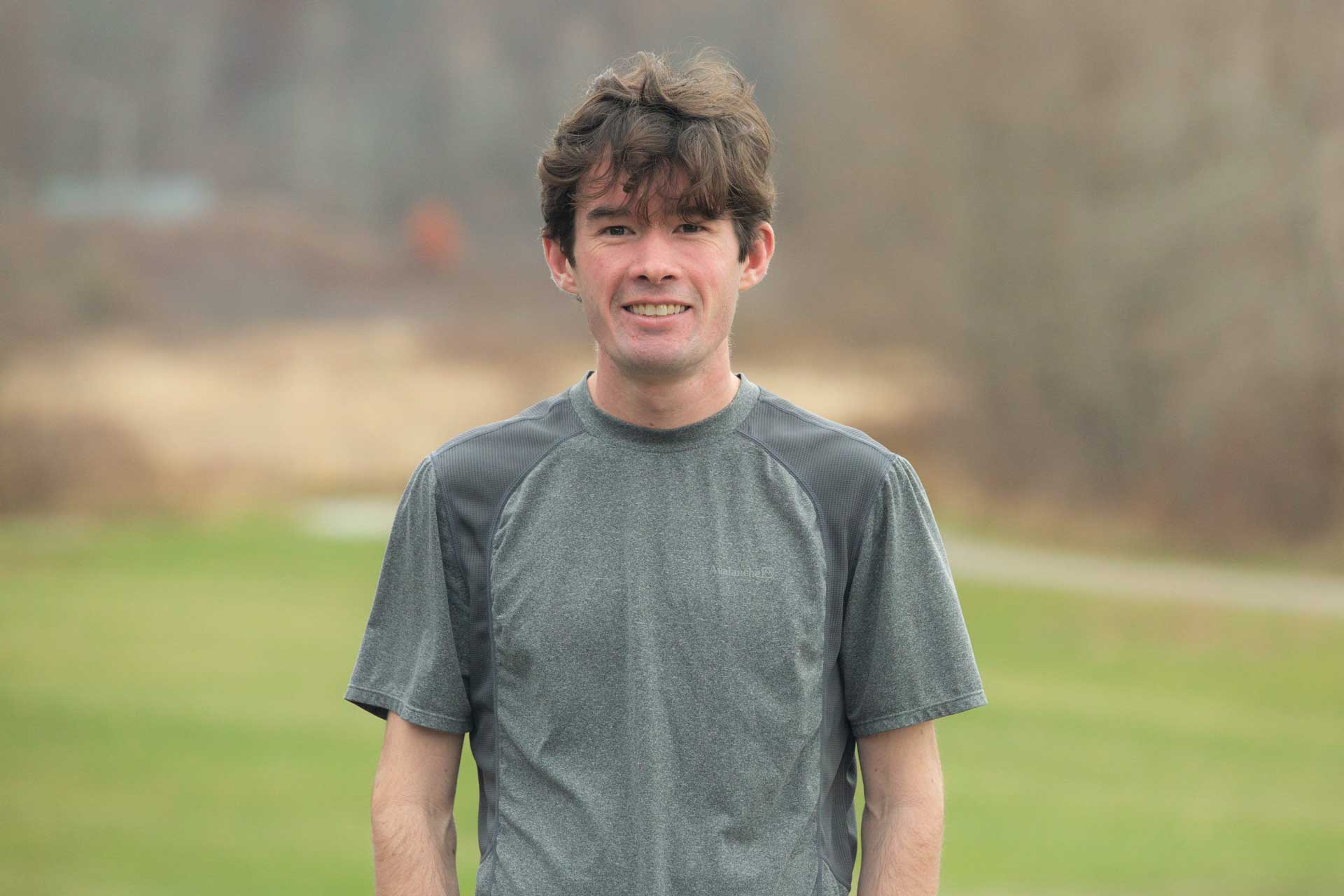 Andrew smiles outside