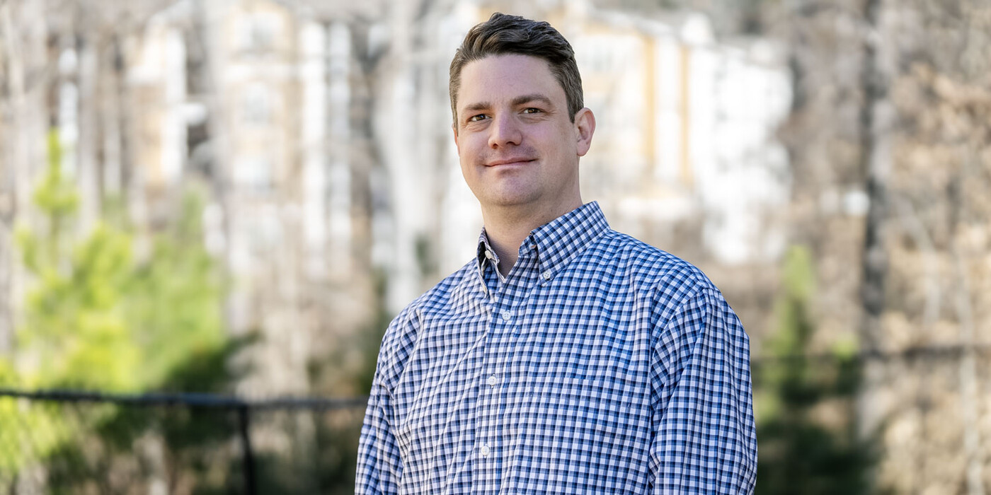 Chris Biggar smiles outside