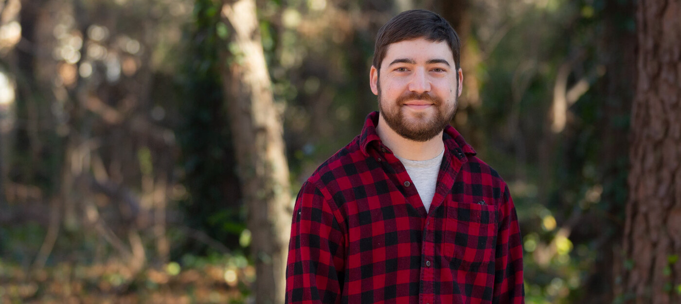 John Welch stands outside