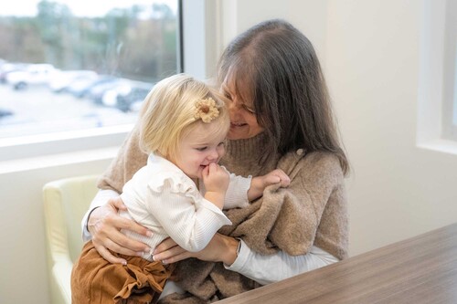 Whitney holds her daughter Jordan