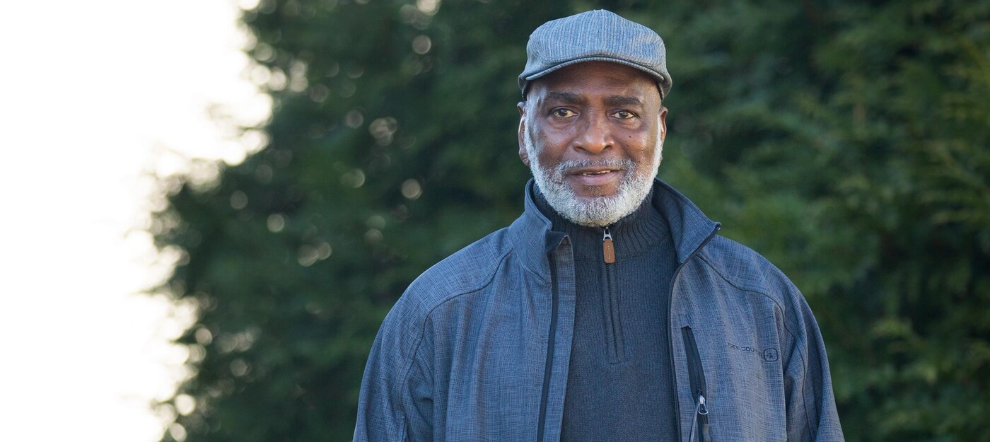 Rodney White smiles outside his home