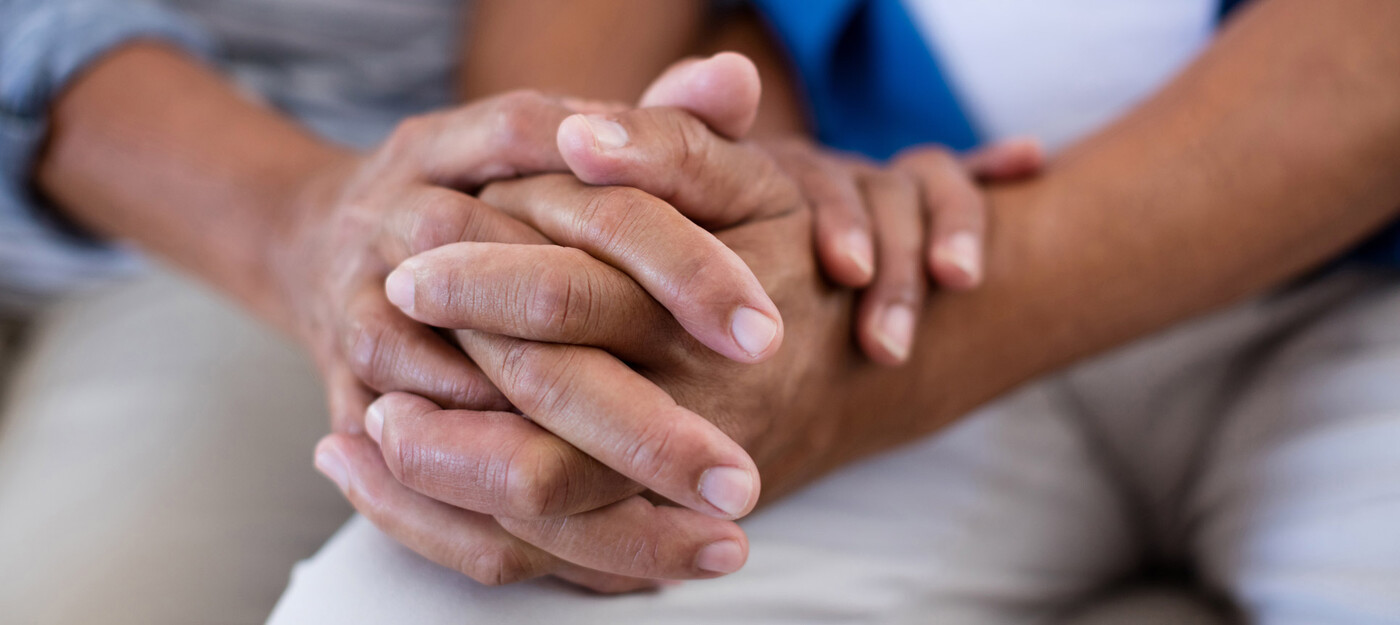 Two people holding hands