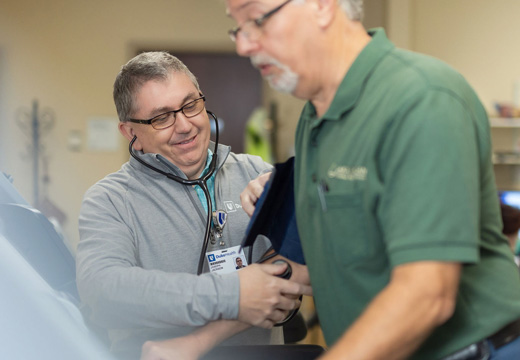 A provider monitors a patient while they exercise