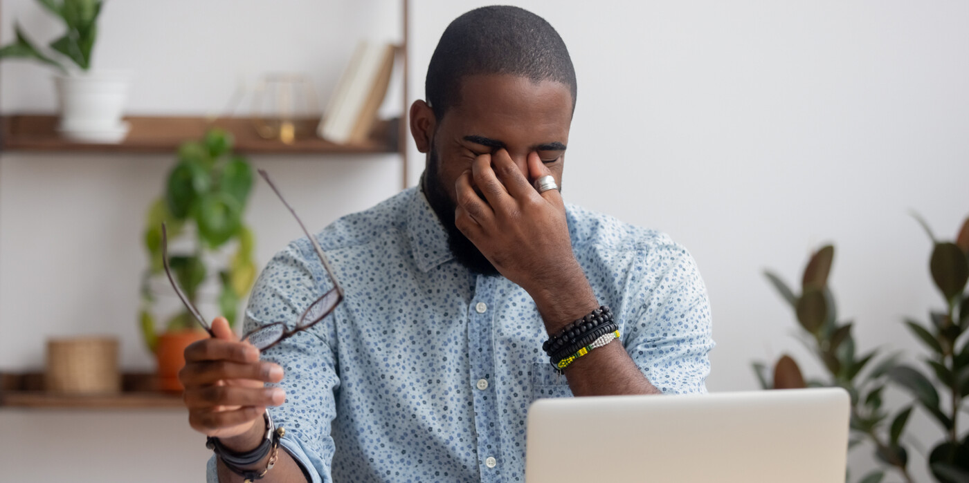 Man rubbing his eyes