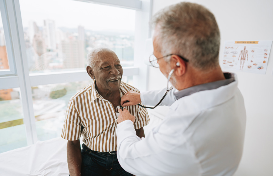 A doctor listens to a patient's heart